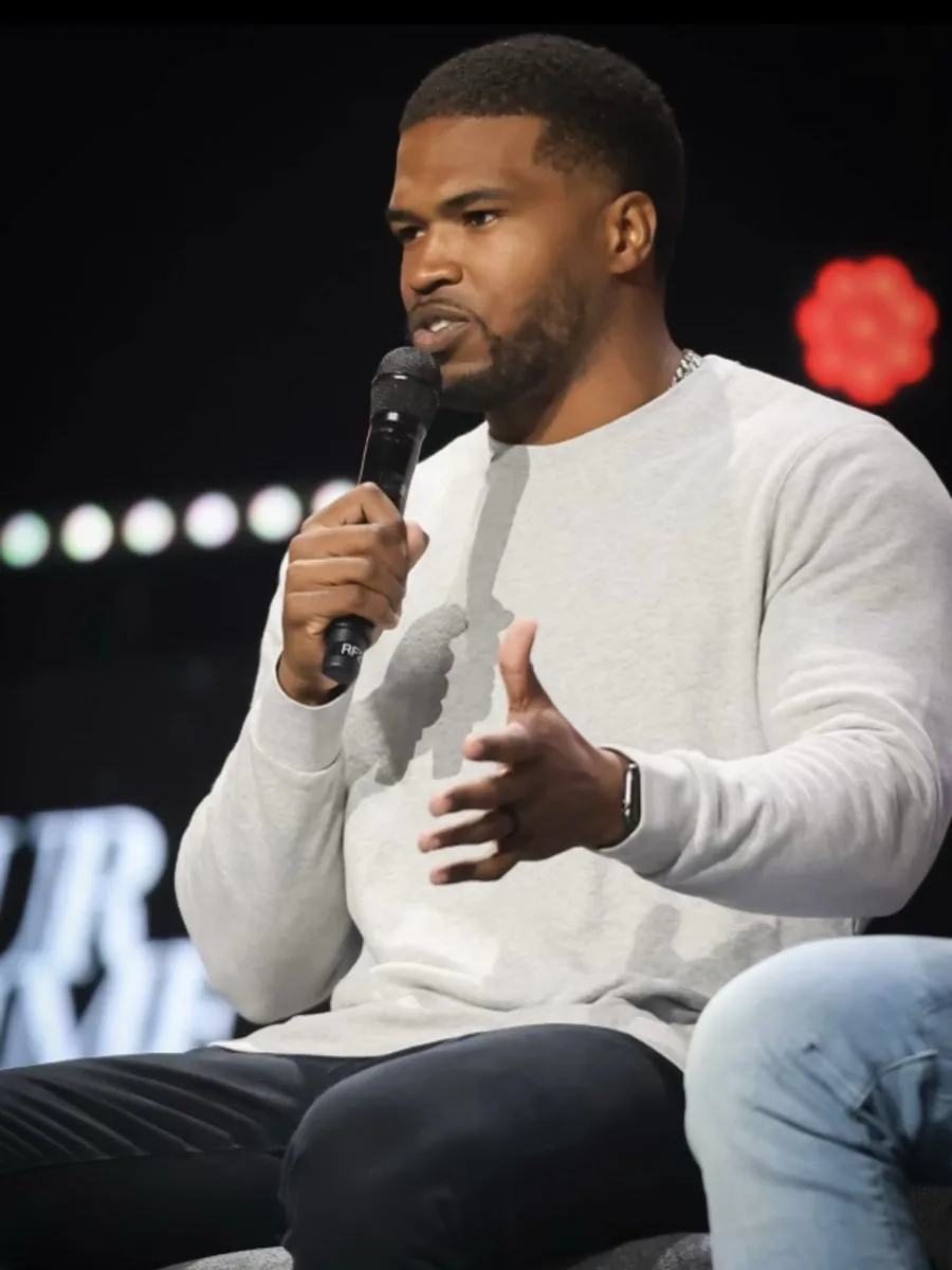 Justin Hilliard speaking on stage